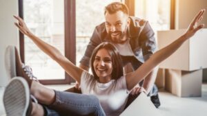 Woman & man moving into their new home