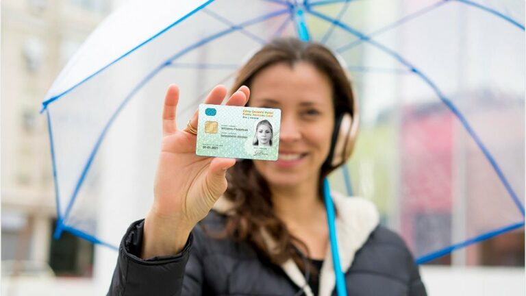 woman-holding-irish-pps-number-card